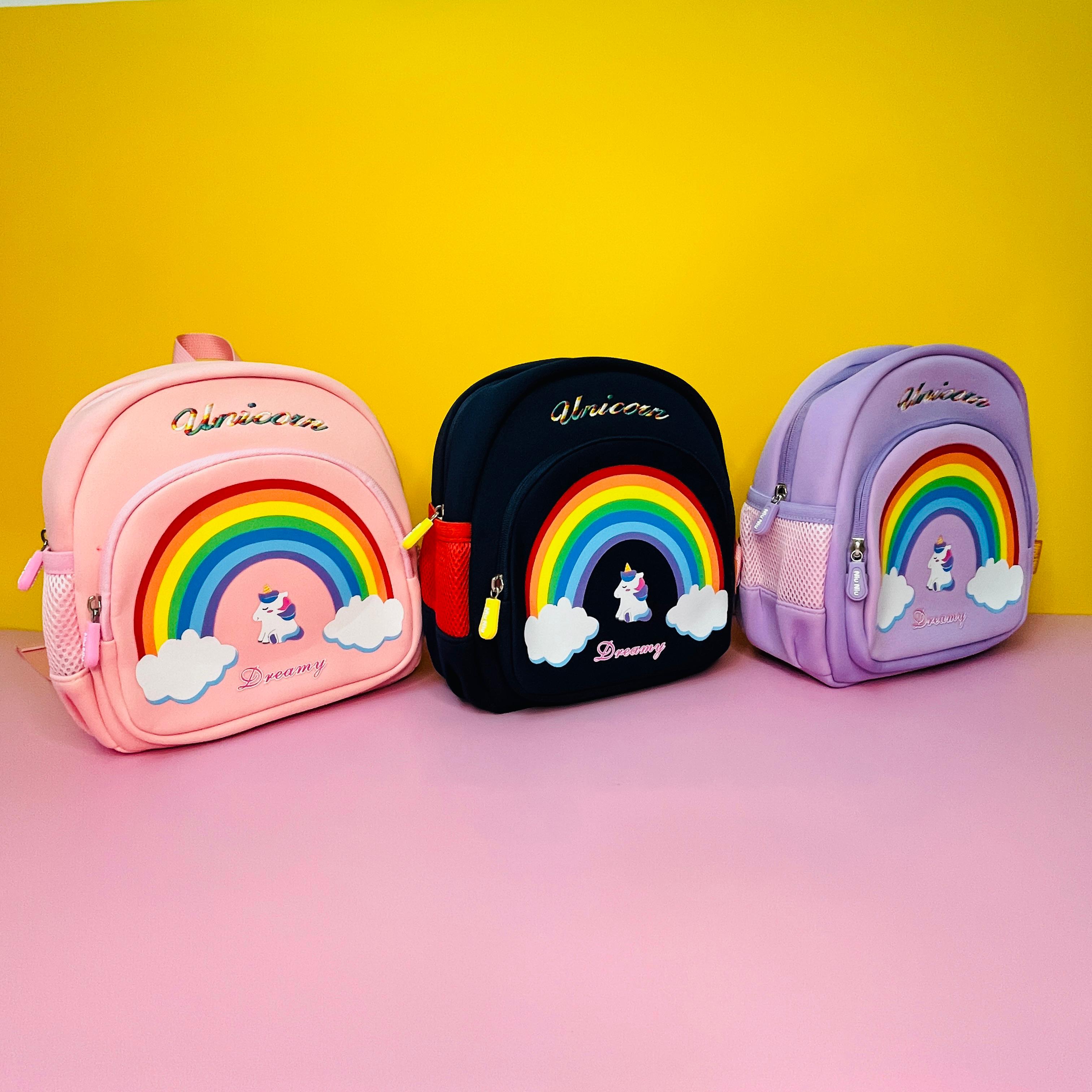Set of three unicorn-themed kids' backpacks with rainbow design – perfect for school and travel."
"Unicorn children bags with safety features – available in pink, navy blue, and purple Usmile.toys